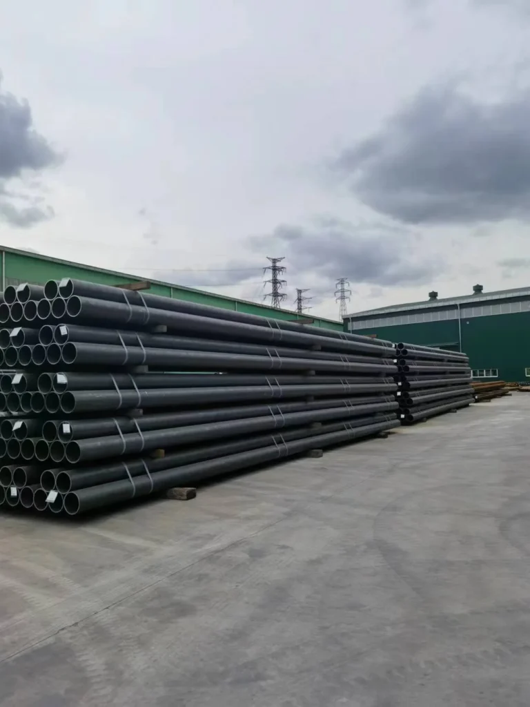 Finished line pipe stacked in the yard