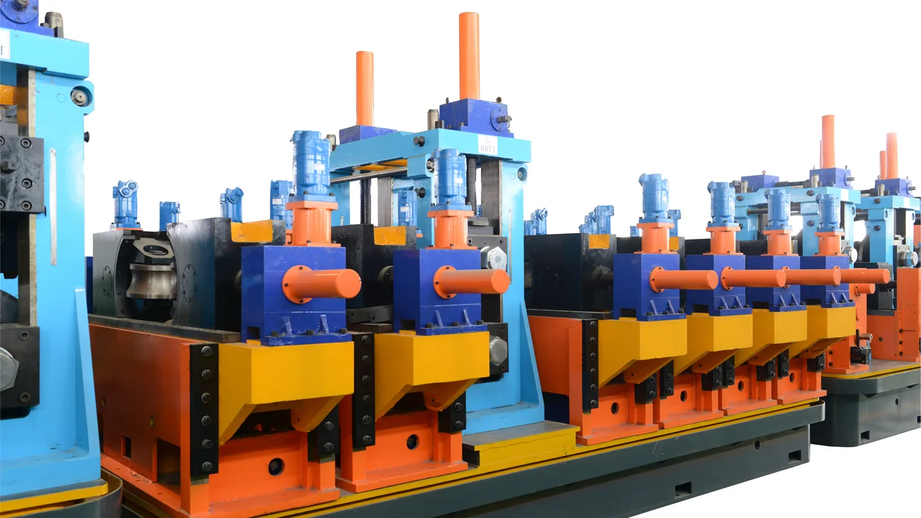 Forming stands of a high-frequency welded tube mill with blue and orange drives