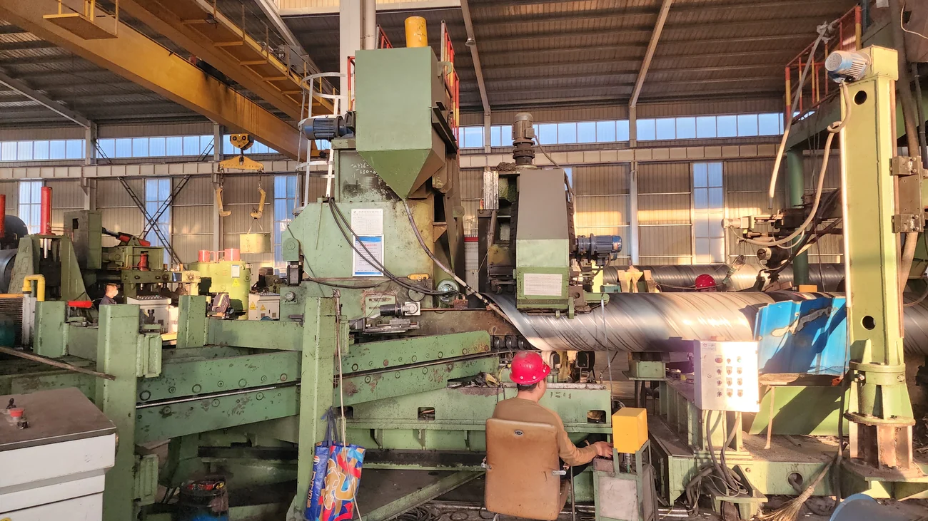 Forming section and operator station of the spiral pipe mill