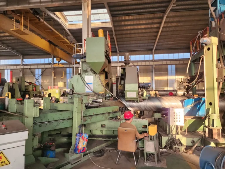 Forming section and operator station of a spiral mill
