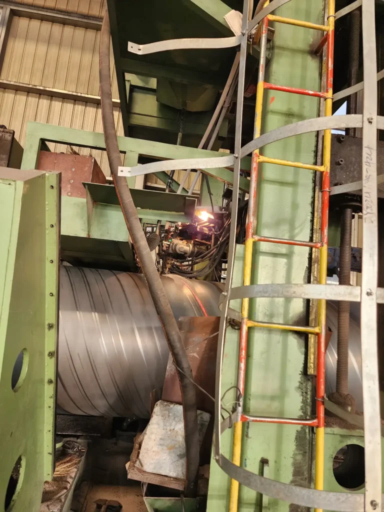Inside weld being laid on a spiral pipe