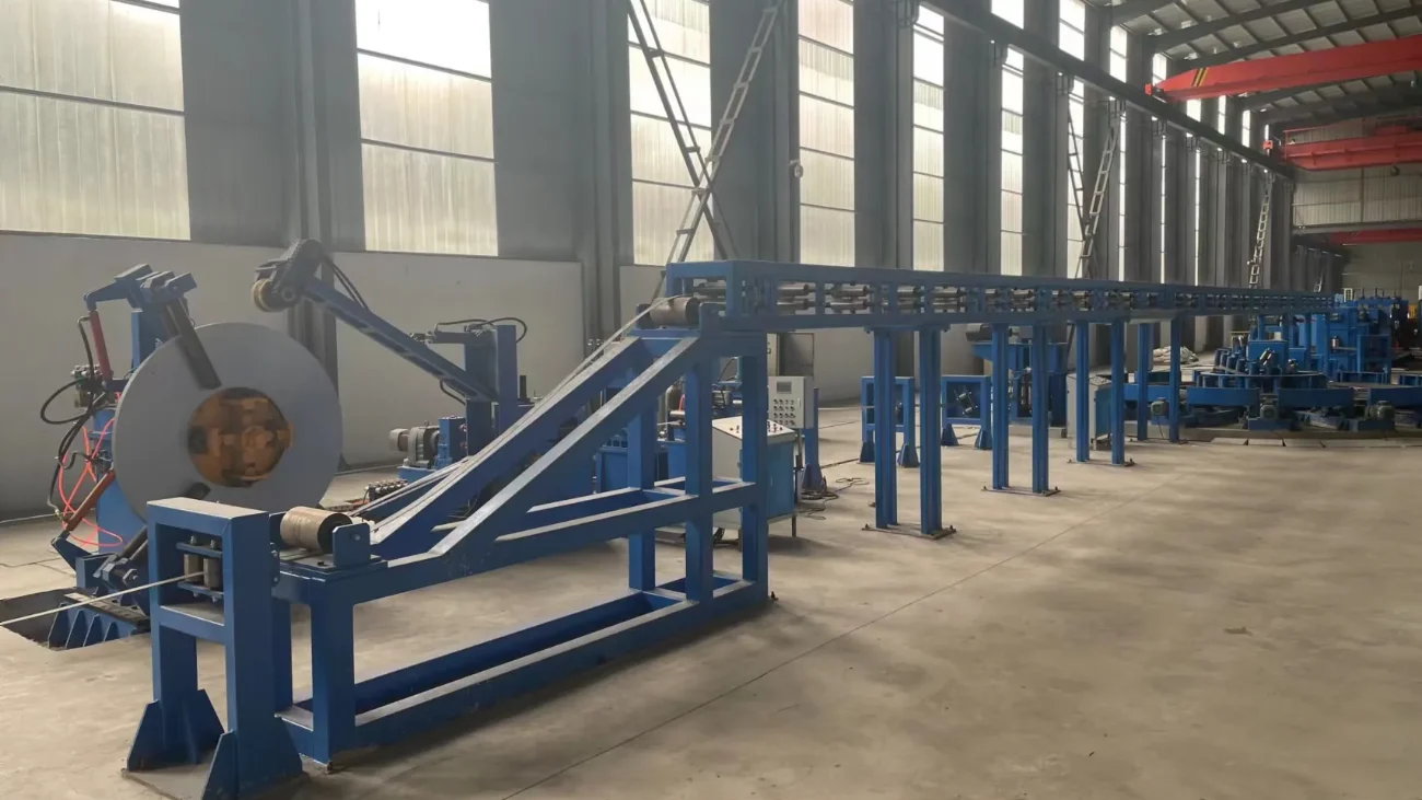 H-beam production line running from the uncoiler down the length of the workshop