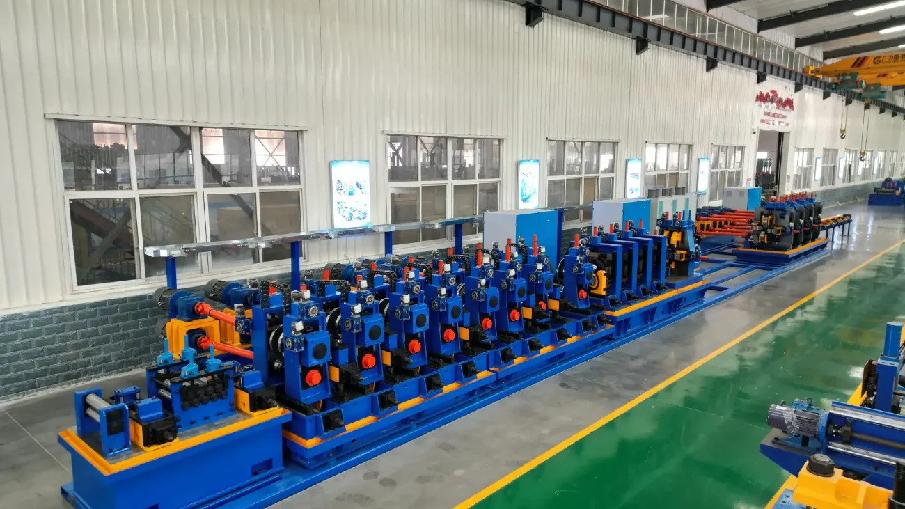 Welded tube mill line along a white-walled workshop bay