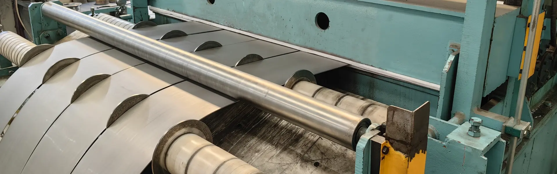 Slit steel strips leaving the slitter knives of a coil slitting line
