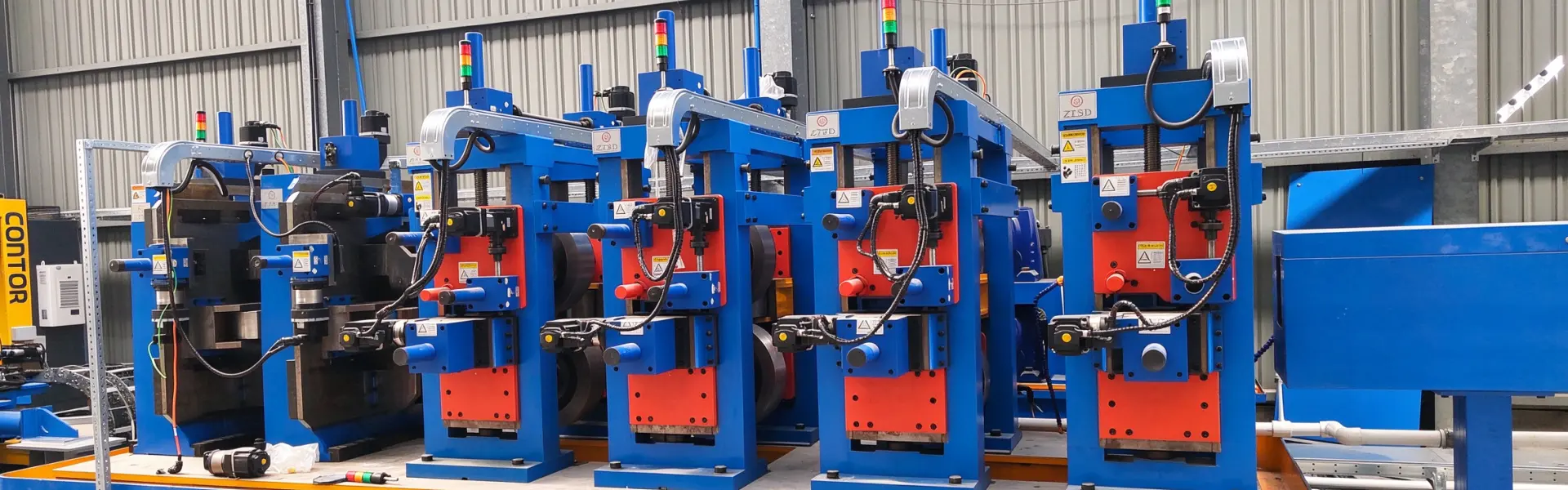 Forming stands with their rolls mounted on a welded tube mill